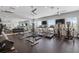 Well-equipped community gym with treadmills, elliptical machines, weights, and mirrored walls at 7209 W Lenox Cir, Punta Gorda, FL 33950