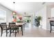 Open-concept interior view with living room, dining room, and kitchen, featuring plenty of natural light at 7209 W Lenox Cir, Punta Gorda, FL 33950