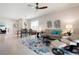 Open-concept living area with stylish furnishings, a dining table, and lots of natural light at 7209 W Lenox Cir, Punta Gorda, FL 33950