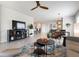 Spacious living area featuring modern furniture, a TV console, and an open layout at 7209 W Lenox Cir, Punta Gorda, FL 33950