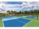 Community pickleball courts with vibrant blue surfaces, perfect for active recreation and friendly competition at 7209 W Lenox Cir, Punta Gorda, FL 33950
