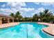 Inviting community pool surrounded by tropical landscaping, offering a serene retreat for residents at 7209 W Lenox Cir, Punta Gorda, FL 33950