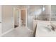 Accessible bathroom featuring walk-in shower, grab bars, and single sink vanity at 8725 Amaretto Ave, Sarasota, FL 34238