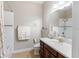 Bright bathroom featuring a shower-tub combination and dark wood vanity at 8725 Amaretto Ave, Sarasota, FL 34238