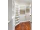 Walk-in closet with custom shelving, drawers, and ample storage space at 8725 Amaretto Ave, Sarasota, FL 34238