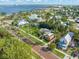 Beautiful aerial view of a residential area near the water, showcasing lush greenery and a clear blue sky at 114 Mcgregor St, Punta Gorda, FL 33950