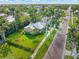 Overhead view of a charming property with lush lawn, landscaping, and inviting curb appeal at 114 Mcgregor St, Punta Gorda, FL 33950