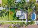 Aerial view showcasing a well-maintained home with manicured lawn, landscaping, and brick sidewalk at 114 Mcgregor St, Punta Gorda, FL 33950