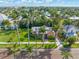 Stunning aerial view of a charming neighborhood with palm trees and lush landscaping at 114 Mcgregor St, Punta Gorda, FL 33950