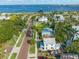 Panoramic aerial view of a coastal neighborhood with lush greenery, palm trees, and water views at 114 Mcgregor St, Punta Gorda, FL 33950
