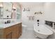 Elegant bathroom featuring a freestanding tub, vanity, and open shelving at 114 Mcgregor St, Punta Gorda, FL 33950