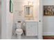 Neat bathroom with white tiled walls, a functional vanity, and essential fixtures for everyday use at 114 Mcgregor St, Punta Gorda, FL 33950