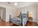 Relaxing bedroom with hardwood floors, ceiling fan, and neutral walls at 114 Mcgregor St, Punta Gorda, FL 33950