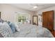 Comfortable bedroom showcasing a bay window, hardwood floors, and ample natural light at 114 Mcgregor St, Punta Gorda, FL 33950