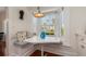 Charming breakfast nook featuring a window seat, white table, and a stylish light fixture at 114 Mcgregor St, Punta Gorda, FL 33950