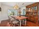 Elegant dining room featuring hardwood floors, large table, and traditional decor, perfect for Gathering meals at 114 Mcgregor St, Punta Gorda, FL 33950