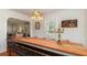 Stylish dining room with hardwood floors, long wooden table, and bright, airy ambiance for entertaining at 114 Mcgregor St, Punta Gorda, FL 33950