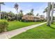 Attractive home with lush lawn, mature trees, and inviting curb appeal in a beautiful neighborhood at 114 Mcgregor St, Punta Gorda, FL 33950