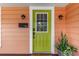 Charming front door with stylish exterior lights, enhancing the home's curb appeal and welcoming entrance at 114 Mcgregor St, Punta Gorda, FL 33950