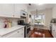Kitchen featuring stainless steel appliances, white countertops, marble backsplash, and breakfast nook at 114 Mcgregor St, Punta Gorda, FL 33950