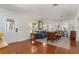 Spacious living area featuring hardwood floors, a cozy seating arrangement, and a bright, airy ambiance at 114 Mcgregor St, Punta Gorda, FL 33950