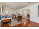 Bright living room with hardwood floors, large windows, and stylish decor, offering a comfortable living space at 114 Mcgregor St, Punta Gorda, FL 33950