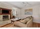 Comfortable living room featuring a fireplace, hardwood floors and a cozy sofa at 114 Mcgregor St, Punta Gorda, FL 33950