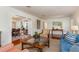 Stylish living room flowing into dining area, featuring hardwood floors, bright light, and comfortable seating at 114 Mcgregor St, Punta Gorda, FL 33950