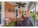 Inviting porch with wicker furniture, perfect for outdoor gatherings and enjoying the fresh air at 114 Mcgregor St, Punta Gorda, FL 33950