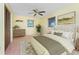 Bright bedroom featuring a ceiling fan, two windows and a neutral color scheme at 1173 Belmar Ave, Port Charlotte, FL 33948
