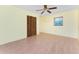 Simple bedroom with wood floors, a ceiling fan and neutral paint at 1173 Belmar Ave, Port Charlotte, FL 33948