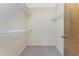 Walk-in closet with carpet flooring and wire shelving for ample storage at 1173 Belmar Ave, Port Charlotte, FL 33948