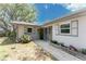 Charming home exterior with stone accents and a well-maintained walkway leading to the front door at 1173 Belmar Ave, Port Charlotte, FL 33948