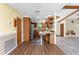 Spacious kitchen featuring wood cabinets, stainless steel appliances, and breakfast bar seating at 1173 Belmar Ave, Port Charlotte, FL 33948