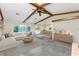 Inviting living room with exposed beams, a large window, and an open dining area at 1173 Belmar Ave, Port Charlotte, FL 33948