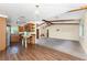 Open-concept kitchen, dining, and living room with beamed ceilings provide ample space for comfortable living and entertaining at 1173 Belmar Ave, Port Charlotte, FL 33948