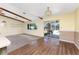 Spacious living room featuring wood beamed ceilings and access to the screened patio and in-ground swimming pool at 1173 Belmar Ave, Port Charlotte, FL 33948