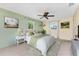 Bright main bedroom featuring fresh paint, carpet flooring, and ceiling fan at 1173 Belmar Ave, Port Charlotte, FL 33948