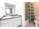 Bathroom featuring granite countertops, white cabinetry, tiled floors, and a shower/tub combo at 1381 Fargo St, Port Charlotte, FL 33952