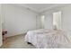 Bright bedroom boasts neutral walls, carpet, and a modern tray ceiling at 15975 Mulrion Blvd, Punta Gorda, FL 33982