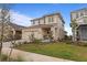 Two-story home featuring a neutral color scheme, attached garage and a driveway made of paving stones at 15975 Mulrion Blvd, Punta Gorda, FL 33982