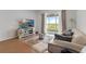 Bright living room with sliding glass doors and contemporary decor at 15975 Mulrion Blvd, Punta Gorda, FL 33982