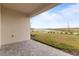 Cozy patio offers stunning view of the lake and green landscape, perfect for outdoor relaxation at 15975 Mulrion Blvd, Punta Gorda, FL 33982