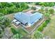 Aerial view of a single-story home with a fenced backyard and covered patio at 17506 Cape Horn Blvd, Punta Gorda, FL 33955