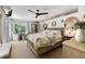 Comfortable bedroom features a rattan bedframe, neutral tones, decorative coral, and ample natural light at 17506 Cape Horn Blvd, Punta Gorda, FL 33955