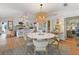 Bright dining room with a round table, a decorative chandelier, and an open concept layout at 17506 Cape Horn Blvd, Punta Gorda, FL 33955