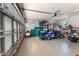 Spacious garage with a golf cart, ample storage space, and well-lit area at 17506 Cape Horn Blvd, Punta Gorda, FL 33955