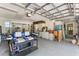 Spacious garage featuring a golf cart, plenty of storage, and a clean, organized space at 17506 Cape Horn Blvd, Punta Gorda, FL 33955
