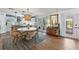 Open-concept kitchen and dining area with an island, stainless appliances, and stylish decor at 17506 Cape Horn Blvd, Punta Gorda, FL 33955