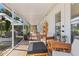 Expansive screened-in patio with comfortable seating, decorative plants, and an inviting outdoor space at 17506 Cape Horn Blvd, Punta Gorda, FL 33955
